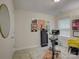 A home exercise room featuring carpeted floors, exercise bike, and decorative wall art at 1209 Gaston Ave, Gastonia, NC 28052