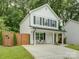 Well-maintained home featuring a modern design and manicured lawn at 1209 Gaston Ave, Gastonia, NC 28052