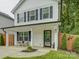 Inviting front porch with stylish seating and classic architectural details at 1209 Gaston Ave, Gastonia, NC 28052
