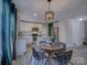 Bright eat-in kitchen with white cabinets, stainless appliances, and modern lighting at 1209 Gaston Ave, Gastonia, NC 28052