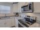 Modern kitchen with stainless steel appliances and granite countertops at 1209 Gaston Ave, Gastonia, NC 28052