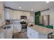 Bright kitchen with stainless appliances, granite counters, and a vibrant green accent wall at 1209 Gaston Ave, Gastonia, NC 28052