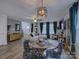 Open concept living room featuring unique wallpaper, modern lighting, and decor at 1209 Gaston Ave, Gastonia, NC 28052
