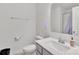 Bright bathroom with a gray vanity, white sink, and a large mirror at 12110 Chesapeake Mallard Dr, Charlotte, NC 28262