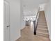 Inviting foyer with wood floors, stairs, and open layout to the kitchen and living area at 12110 Chesapeake Mallard Dr, Charlotte, NC 28262