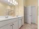 Bright bathroom with double sinks, ample counter space, and a glass-enclosed shower at 1219 Crown Vista Dr, Fort Mill, SC 29707