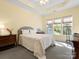 Cozy bedroom with a queen-sized bed, carpeted floors, and sunlit windows at 1219 Crown Vista Dr, Fort Mill, SC 29707