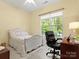 Comfortable bedroom featuring a bed, desk, and a window with natural light at 1219 Crown Vista Dr, Fort Mill, SC 29707