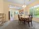 Dining area open to kitchen features a bay window with views of the backyard at 1219 Crown Vista Dr, Fort Mill, SC 29707
