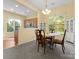 Bright dining area featuring a dining table and large windows overlooking trees at 1219 Crown Vista Dr, Fort Mill, SC 29707
