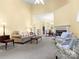 Comfortable living room featuring a fireplace, neutral colors, and an open floor plan to the dining area at 1219 Crown Vista Dr, Fort Mill, SC 29707