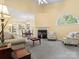 Bright living room featuring a fireplace, ceiling fan, and adjacent dining area at 1219 Crown Vista Dr, Fort Mill, SC 29707