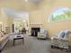 Bright living room with fireplace and large window, showcasing open floor plan to dining area at 1219 Crown Vista Dr, Fort Mill, SC 29707