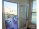 View of the deck and backyard through glass doors, showing outdoor seating and well-maintained lawn at 126 W Warfield Dr, Mooresville, NC 28115