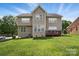 Expansive backyard featuring well-maintained lawn and deck, perfect for outdoor enjoyment at 126 W Warfield Dr, Mooresville, NC 28115
