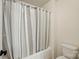 Cozy bathroom showcasing a shower/tub combo with a striped curtain and standard toilet at 126 W Warfield Dr, Mooresville, NC 28115