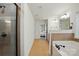 Bright bathroom featuring tile flooring, soaking tub, walk-in shower, and natural light at 126 W Warfield Dr, Mooresville, NC 28115