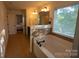 Bright bathroom featuring a large soaking tub and vanity with modern fixtures at 126 W Warfield Dr, Mooresville, NC 28115