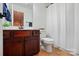Traditional bathroom featuring a dark wood vanity, ample counter space, and classic fixtures at 126 W Warfield Dr, Mooresville, NC 28115