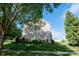 Well-maintained home with manicured landscaping and mature trees, creating a serene and inviting curb appeal at 126 W Warfield Dr, Mooresville, NC 28115