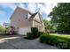 Charming two-story home with brick and siding, a two-car garage, and landscaped front yard at 126 W Warfield Dr, Mooresville, NC 28115