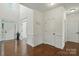 Bright foyer features soaring ceilings, transom window, and beautiful hardwood floors at 126 W Warfield Dr, Mooresville, NC 28115