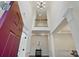 Two-story foyer featuring an open staircase and elegant chandelier at 126 W Warfield Dr, Mooresville, NC 28115