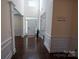 Inviting foyer with soaring ceilings, hardwood floors, and elegant trim work at 126 W Warfield Dr, Mooresville, NC 28115
