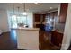 Stylish kitchen featuring granite countertops, dark cabinetry, stainless appliances, and an open layout at 126 W Warfield Dr, Mooresville, NC 28115