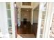 View of an open living area with hardwood flooring and classic wainscoting at 126 W Warfield Dr, Mooresville, NC 28115