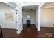 View of an open living area with hardwood flooring and classic wainscoting at 126 W Warfield Dr, Mooresville, NC 28115