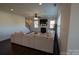Cozy living room featuring a fireplace, large sofa, hardwood floors, and ample natural light at 126 W Warfield Dr, Mooresville, NC 28115