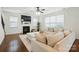 Bright living room features a fireplace, large windows, and a neutral sectional sofa at 126 W Warfield Dr, Mooresville, NC 28115