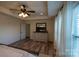 Charming main bedroom with wood floors and windows that let in plenty of light at 126 W Warfield Dr, Mooresville, NC 28115