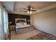 A serene main bedroom with wood floors and natural light at 126 W Warfield Dr, Mooresville, NC 28115