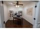 Cozy office space with built-in bookshelves and a ceiling fan at 126 W Warfield Dr, Mooresville, NC 28115