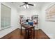 Well-lit office with hardwood floors, ceiling fan, and built-in shelving at 126 W Warfield Dr, Mooresville, NC 28115