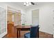 Office with hardwood floors, a neutral color scheme, and adjacent bonus room at 126 W Warfield Dr, Mooresville, NC 28115