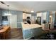 Modern kitchen with white cabinetry, stainless steel appliances, and breakfast bar at 13241 Woodland Farm Dr, Charlotte, NC 28215