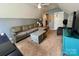 Upstairs living room space features lounge furniture, tv, and carpeted floors at 13241 Woodland Farm Dr, Charlotte, NC 28215