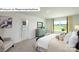 Bedroom featuring natural light, plush bedding, ensuite bathroom, and neutral paint at 1361 Secrest Commons Dr, Monroe, NC 28112