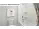 Clean white bathroom featuring a shower-tub combination with coordinated fixtures and neutral decor at 1365 Secrest Commons Dr, Monroe, NC 28112