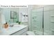 Modern bathroom featuring a glass-enclosed shower, vanity with sink, and sleek fixtures at 1365 Secrest Commons Dr, Monroe, NC 28112