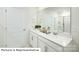 Bright bathroom featuring double vanity, white cabinets, white countertops, and large mirror at 1365 Secrest Commons Dr, Monroe, NC 28112