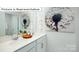 Bright bathroom featuring double sinks, white cabinets, modern fixtures, and stylish dandelion-themed artwork at 1365 Secrest Commons Dr, Monroe, NC 28112
