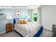 Cozy bedroom featuring a blue bed, soft neutral bedding, bedside tables, and window at 1365 Secrest Commons Dr, Monroe, NC 28112