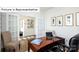 Well-lit home office with French doors, a wooden desk, and comfortable seating at 1365 Secrest Commons Dr, Monroe, NC 28112