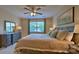 Serene bedroom with a large window, comfortable bedding, and a dresser for ample storage at 141 Way Cross Ln, Troutman, NC 28166