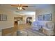 Open-concept living room showcases hardwood floors, neutral décor, and seamless flow into the dining area at 141 Way Cross Ln, Troutman, NC 28166