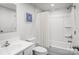 Clean bathroom featuring a shower with curtain, toilet, vanity and a decorative art piece hanging on the wall at 1430 Samuel St, Charlotte, NC 28206